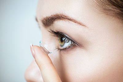 woman with contact lens